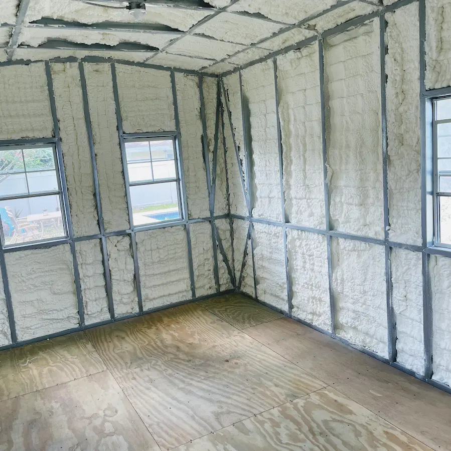 Closed-cell spray foam insulation applied to wall cavities in a residential project in Credit River